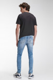 Jean súper skinny tiro bajo azul medio con rotos y desgastes de color