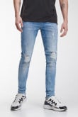 Jean súper skinny tiro bajo azul medio con rotos y desgastes de color