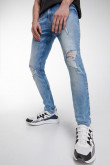 Jean súper skinny tiro bajo azul medio con rotos y desgastes de color