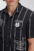 Camisa negra a rayas con manga corta y diseños de Félix el Gato