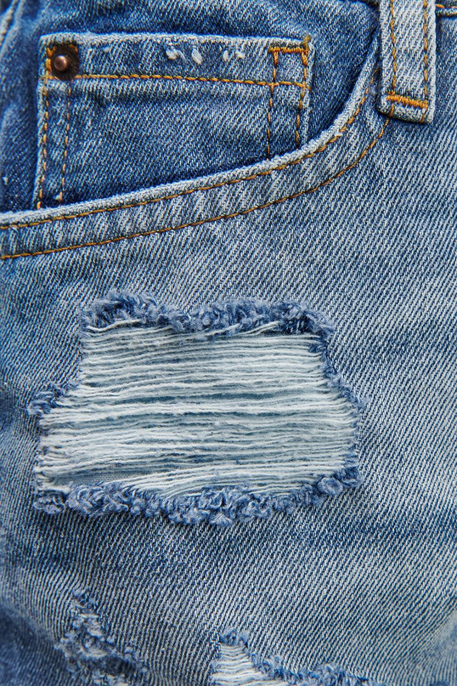 Short en jean azul oscuro tiro alto con rotos y bordes deshilados