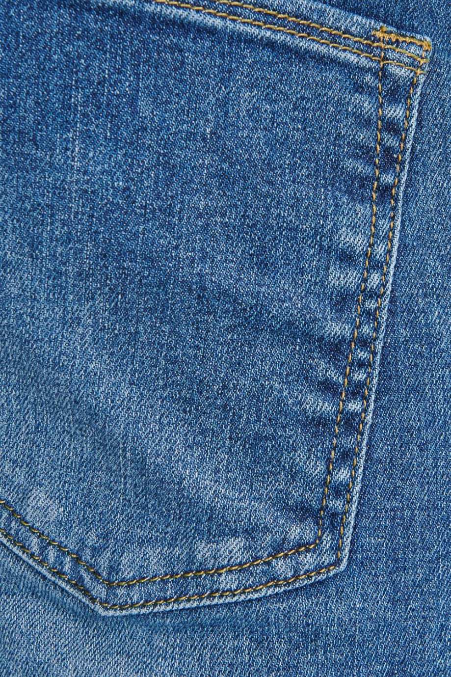 Jean slim azul oscuro con detalles en láser y rotos en las rodillas
