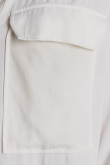 Blusa unicolor manga larga con charreteras y doble bolsillo delantero