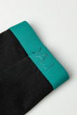 Bóxer negro tipo brief con elástico verde azul en la cintura
