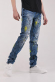 Jean skinny azul medio con rotos y estampados de manchas