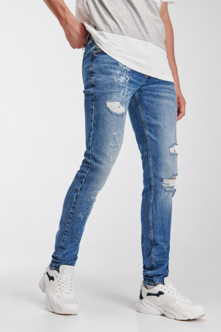 Jean skinny azul con rotos y diseños de Mickey and Friends