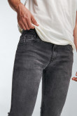 Jean gris oscuro skinny con botón en la cintura y tiro bajo