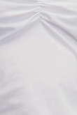 Blusa manga corta unicolor escotada con recogido en frente