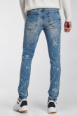 Jean súper skinny azul medio con diseños en láser y rotos en frente