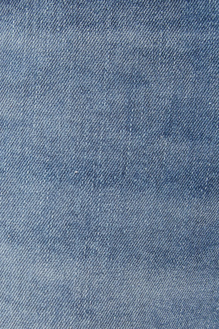 Jean azul medio súper skinny con tiro bajo y ajuste ceñido