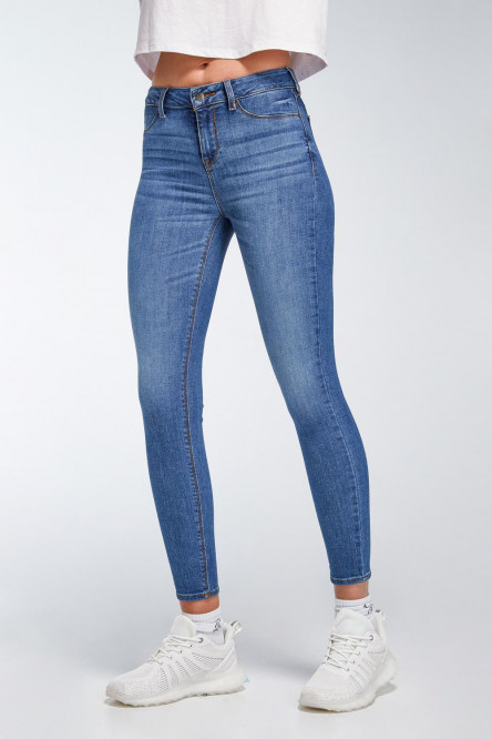 Jean tiro alto jegging azul oscuro con desgastes y bolsillos