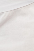 Blusa blanca manga corta tipo globo con moño en frente