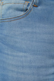 Jean azul medio súper skinny tiro bajo con efectos corrugados
