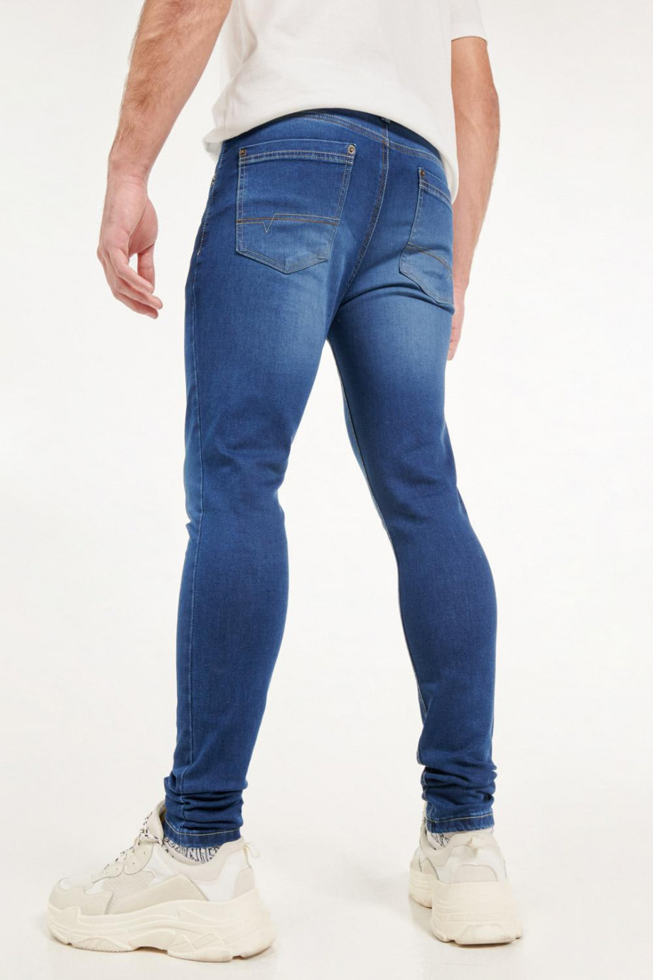 Jean azul oscuro skinny fit tiro bajo con costuras en contraste