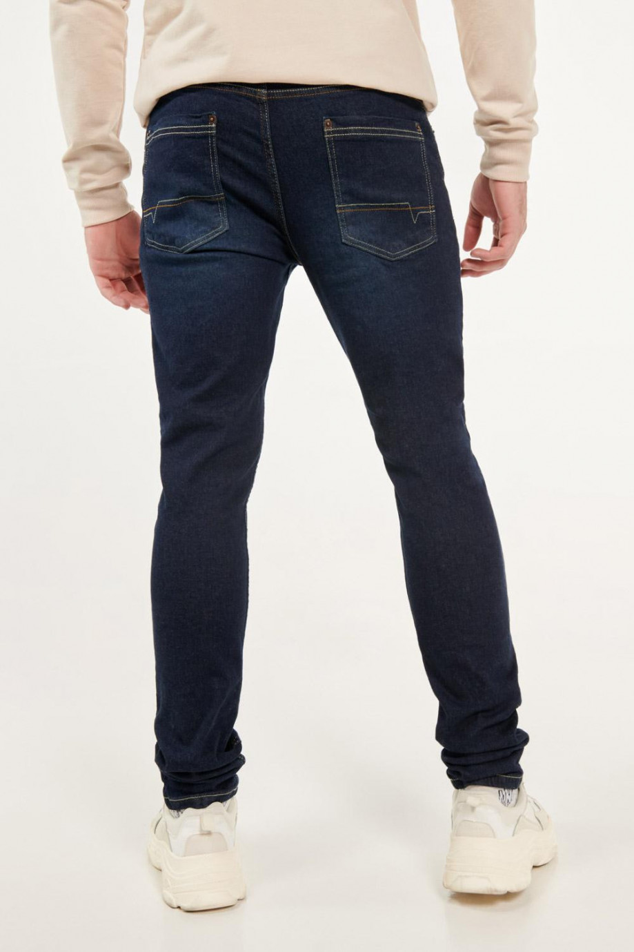 Jean skinny fit azul intenso con hilos en contraste y tiro bajo