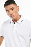 Camiseta unicolor polo con detalles tejidos de rayas