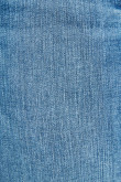 Jean azul medio tipo jegging con tiro súper alto y costuras en contraste