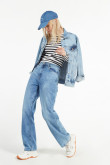 Jean ancho 90´S azul medio con tiro alto y botas amplias