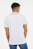 Camiseta polo unicolor con tejido en cuello y puños