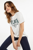 Camiseta cuello redondo crema clara con diseño verde college de Atlanta