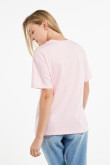 Camiseta cuello redondo rosada clara con diseño blanco college de Texas