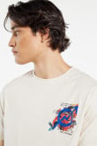 Camiseta oversize crema clara con diseños artísticos estampados