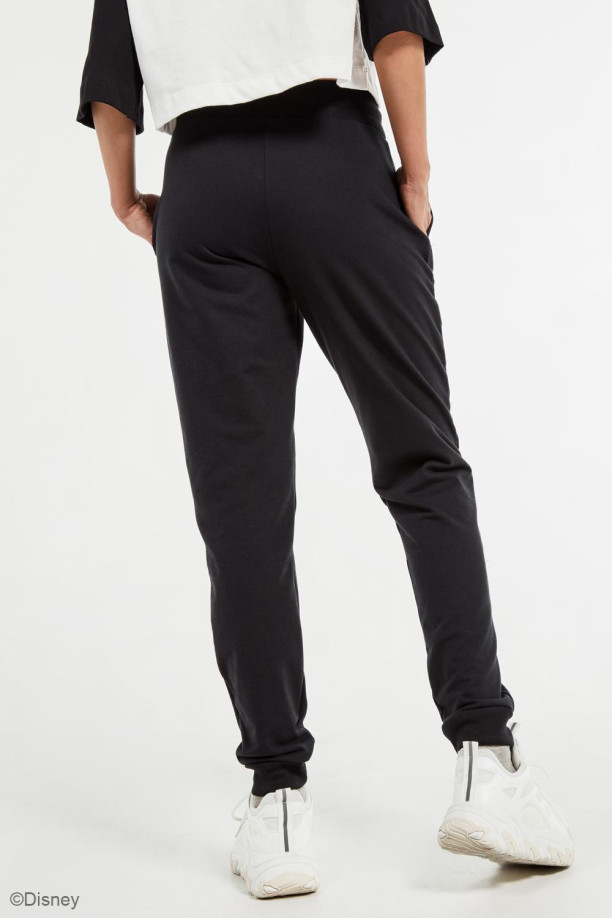 Pantal n negro jogger con estampado lateral de Disney 100