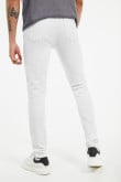 Jean súper skinny blanco con bolsillos y tiro bajo