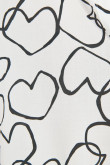 Blusa manga corta crema clara con diseños de corazones negros