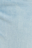 Jean slim azul claro con tiro bajo y desgastes de color