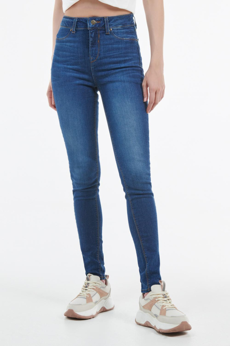 Jean jegging azul oscuro con desgastes de color y tiro alto