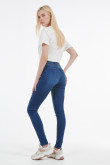 Jean jegging azul oscuro con desgastes de color y tiro alto