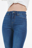 Jean jegging azul oscuro con desgastes de color y tiro alto