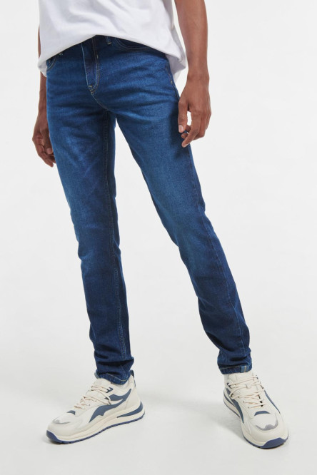 Jean azul oscuro tipo skinny con costuras en contraste y tiro bajo