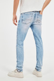 Jean skinny azul claro con desgastes, bolsillos y tiro bajo