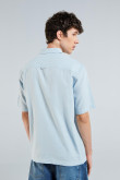 Camisa unicolor en algodón con bolsillo y manga corta