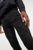 Jean súper skinny negro con rotos, bolsillos y tiro bajo