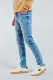 Jean azul claro skinny con tiro bajo y desgastes de color