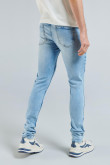 Jean skinny azul claro con efectos desteñidos y tiro bajo