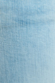 Jean skinny azul claro con efectos desteñidos y tiro bajo
