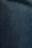 Jean slim azul ajustado con costuras cafés y tiro bajo