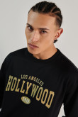 Buzo cuello redondo unicolor con diseño college de Hollywood