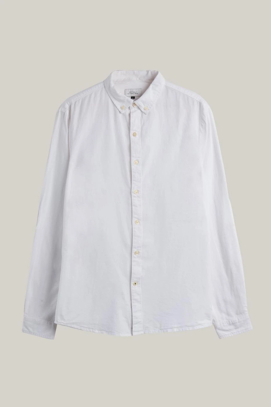 Camisa en algodón unicolor con manga larga y cuello button