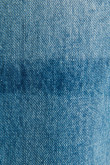 Jean 90´S tiro alto azul claro con desgastes de color y bota ancha