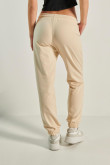 Pantalón jogger unicolor con bolsillos y elástico en cintura y bota