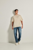 Camiseta oversize kaki clara con cuello redondo y estampados