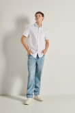 Camisa manga corta unicolor con bolsillo y botones en frente