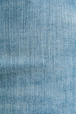 Jean tiro alto jegging azul claro con desgastes de color