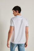 Camiseta polo unicolor con cuello nerú y puños tejidos