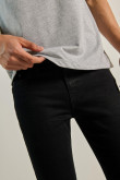 Jean skinny ajustado negro con tiro bajo y 5 bolsillos
